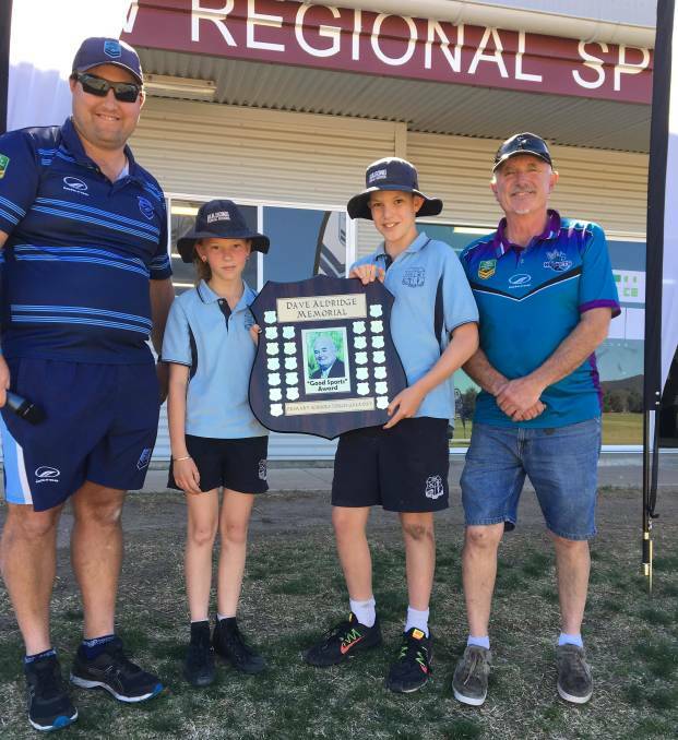 2019: NSW Touch Football Development Officer Ricky Hetherington and Mudgee Touch Association life member Roger Lang with students from Gulgong Public School.