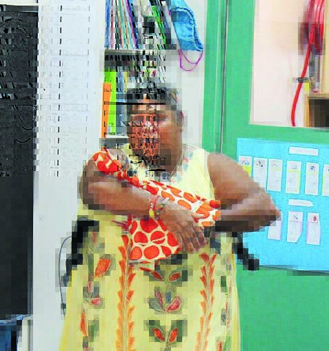 EDUCATOR: Aunty Mary Hooker pictured in 2016 showing the children of Mudgee Preschool the doll she had when she was their age. Photo: File