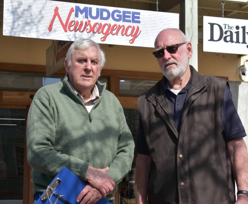 Bob McKittrick and David Lynch outside of the Mudgee Newsagency on August 8 where they will stock a floodplain study petition. Picture: Jay-Anna Mobbs