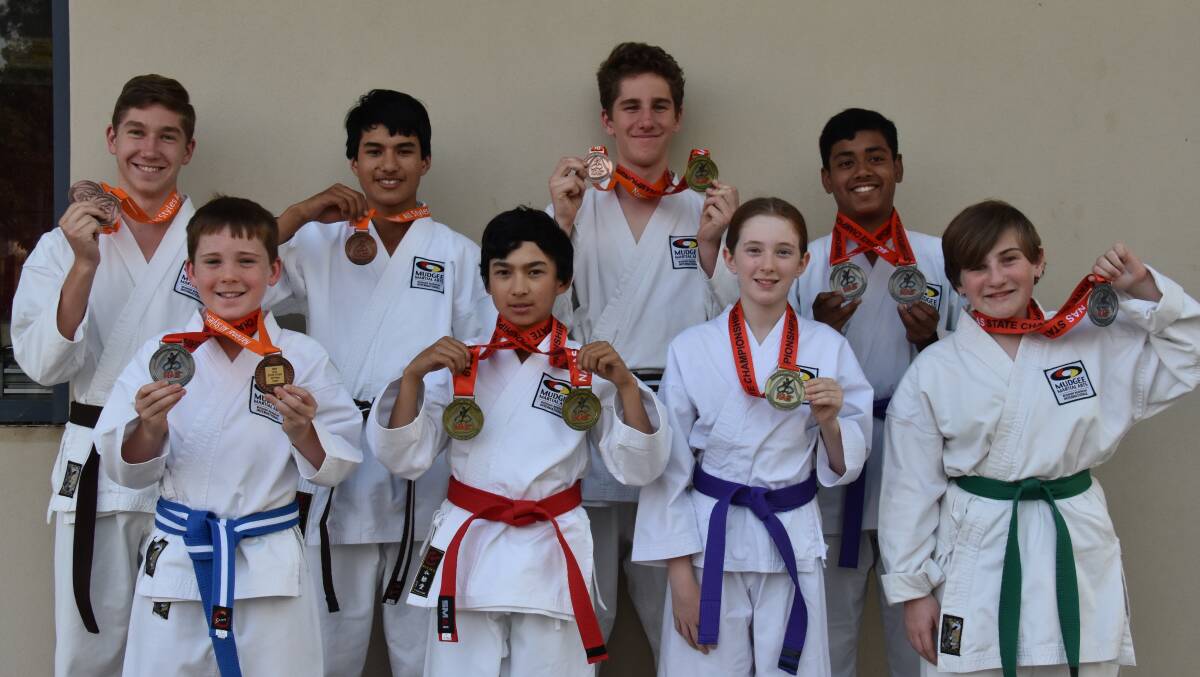 KARATE CHAMPIONS: Back row: Hayden Lowe, William Drakeford, Jack Newman, Arnab Ghosh. Front row: Liam Standen, Allen Drakeford, Ashley Maher, Jessika Newman. Photo: Jay-Anna Mobbs