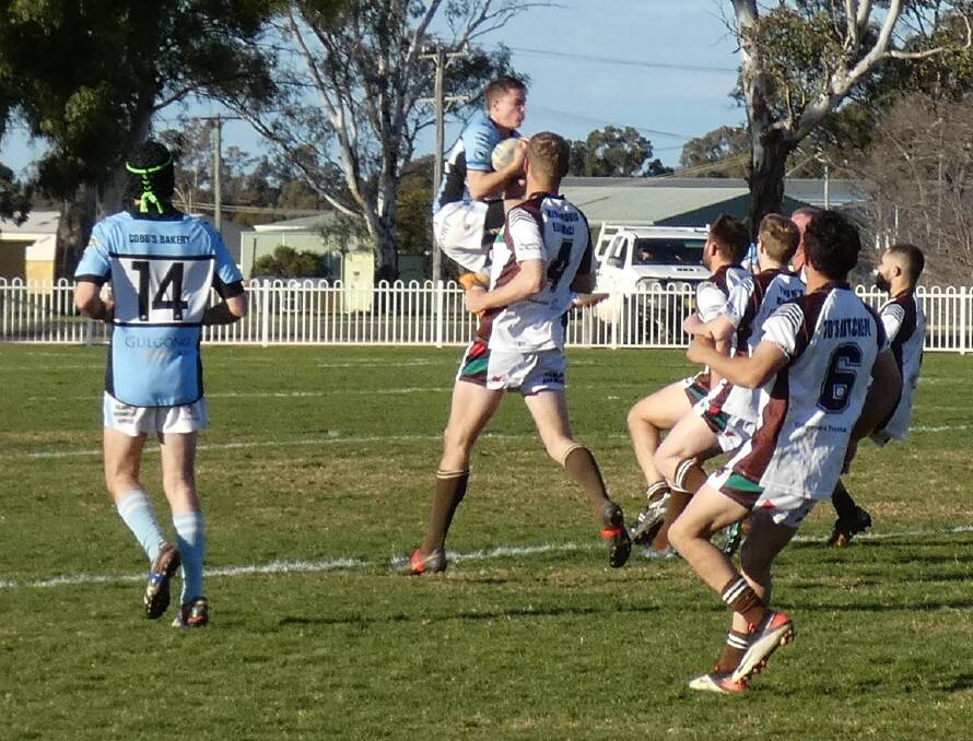 IN IT TO WIN IT: Sam Gorrie launches himself to make the catch for the Gulgong Terriers in their round 16 clash against the Gilgandra Panthers. Photo: Maree Buckley