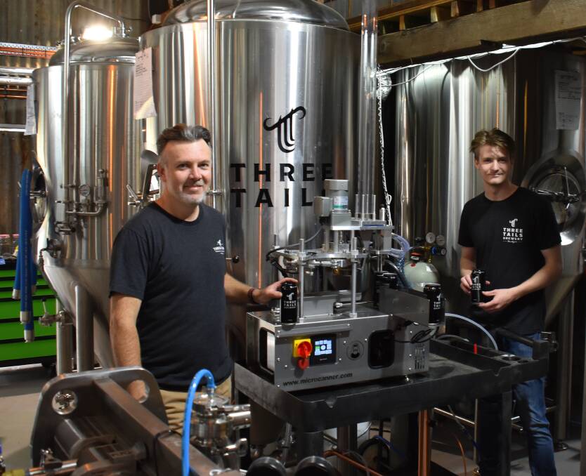 PACKAGE: Scott O'Brien and Thomas Swords in front of the Three Tails micro canner. Picture: JAY-ANNA MOBBS