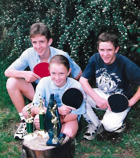 Michelle (8) with her brothers, John and Rob.