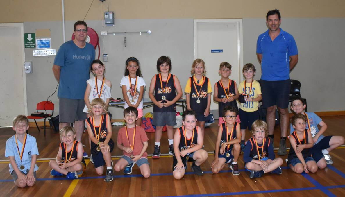 Players in the 5 to 8 years program with coaches Peter Mayson and Adam Keightley.