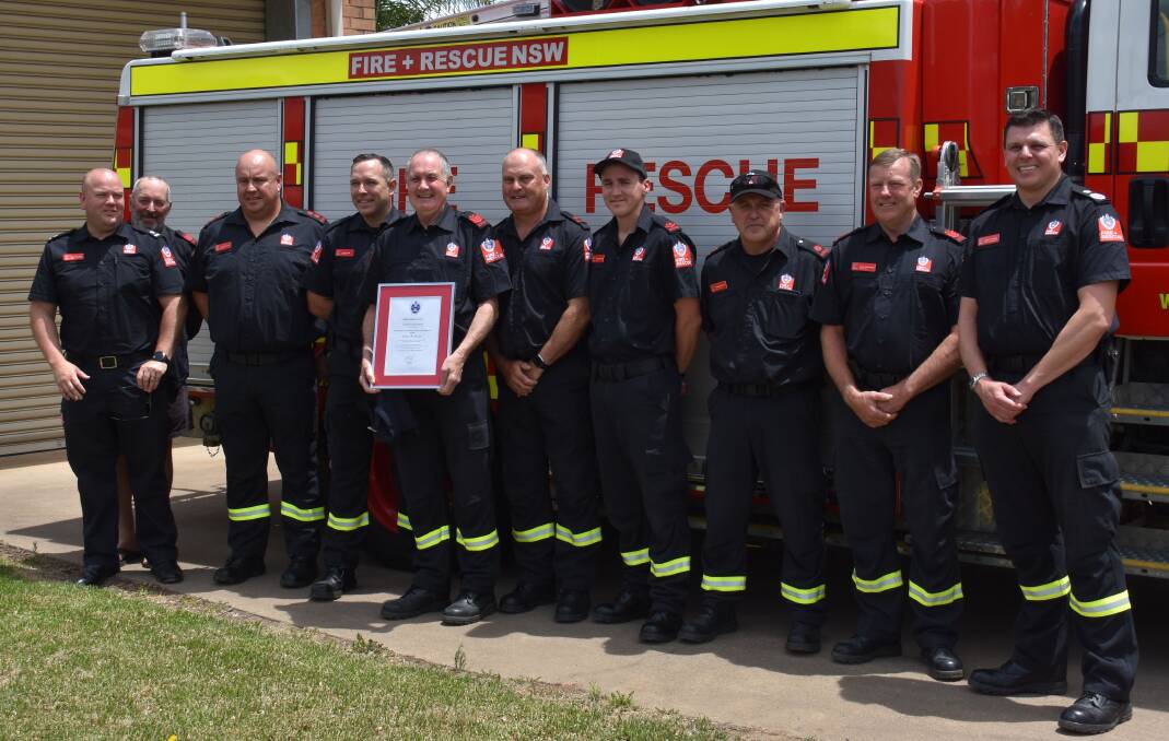 UNIT: Vic Southgate (holding award) with Mudgee Fire Brigade firefighters and Deputy Commissioner Jeremy Fewtrell (right). Picture: JAY-ANNA MOBBS