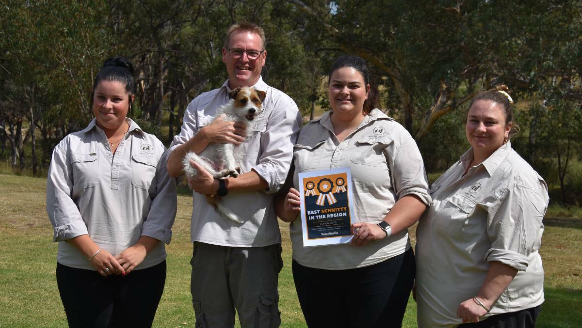 BEST IN THE REGION: The Cooyal Hotel owner David Miller holding pub mascot, Phin alongside Adelle, Adair and Jo. Photo: Jay-Anna Mobbs
