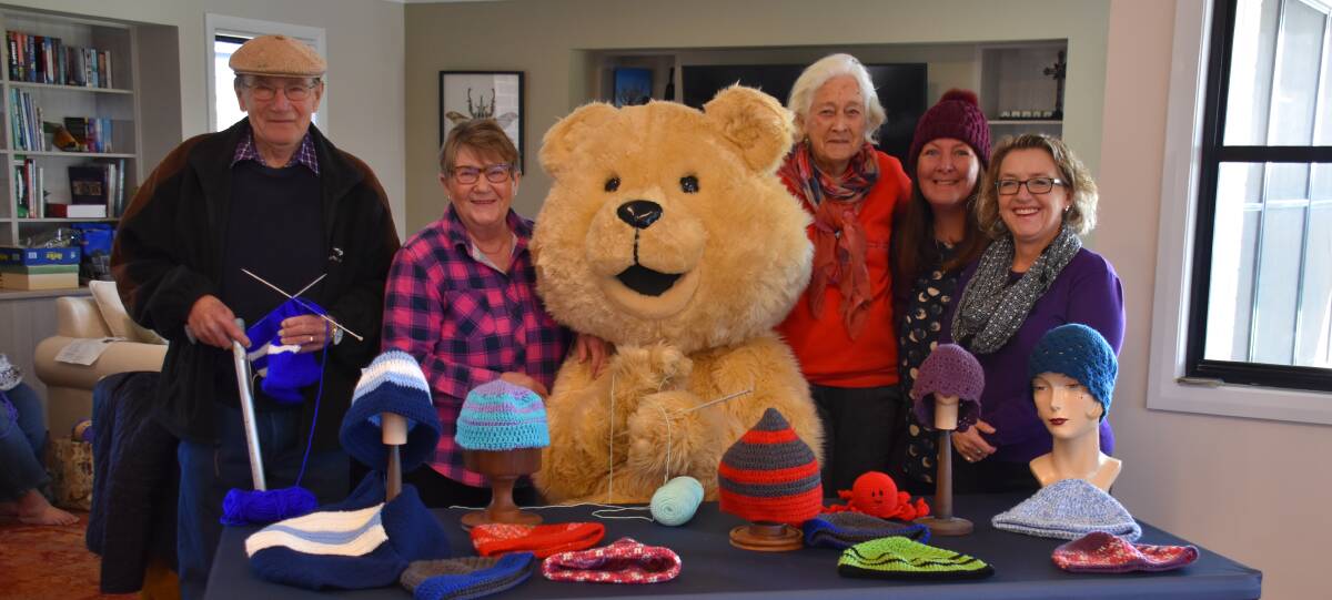 KNIT FOR CANCER: Rob Waller, Marie Dempsey, Dougal, Pam Francis, Linda Fielding, Rebecca Redfern. Photo: Jay-Anna Mobbs