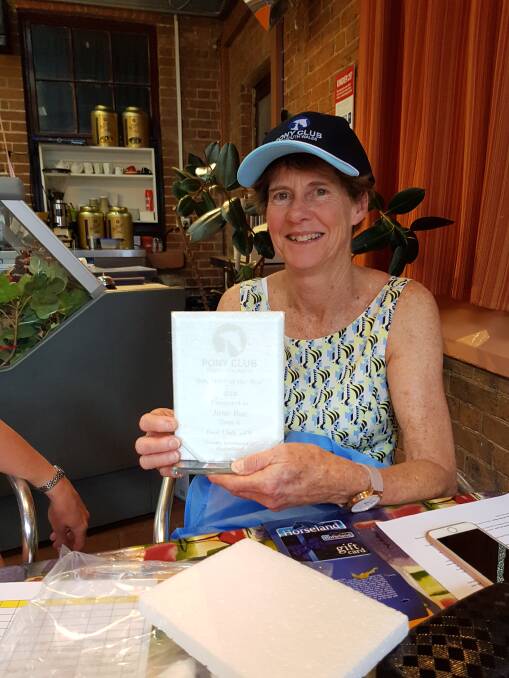 CONGRATULATIONS: Jane Rae recieving the Pony Club Volunteer of the Year award for her ongoing involvement in the Hargraves Triamble Pony Club. Photo: Supplied.