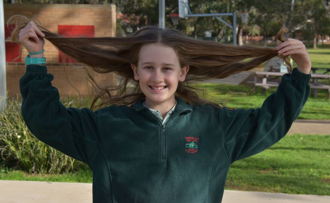 KIND-HEARTED: Dusty May has been growing out his hair for five years just so he can donate it to cancer research. Photo: Jay-Anna Mobbs