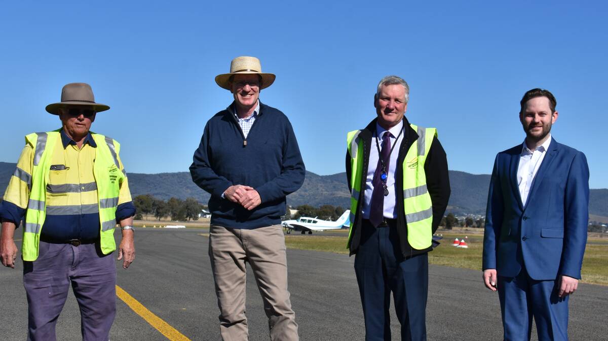 BOOST FOR REGION: Bob Husband, Member for Calare Andrew Gee MP, Mid-Western Regional Council general manager Brad Cam, and Mid-Western Regional Council deputy mayor Sam Paine at Mudgee Airport. Photo: Jay-Anna Mobbs