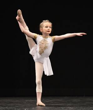 SKILL: Eight-year-old Violet Smith centre stage during a lyrical routine. Picture: WINKIPOP MEDIA