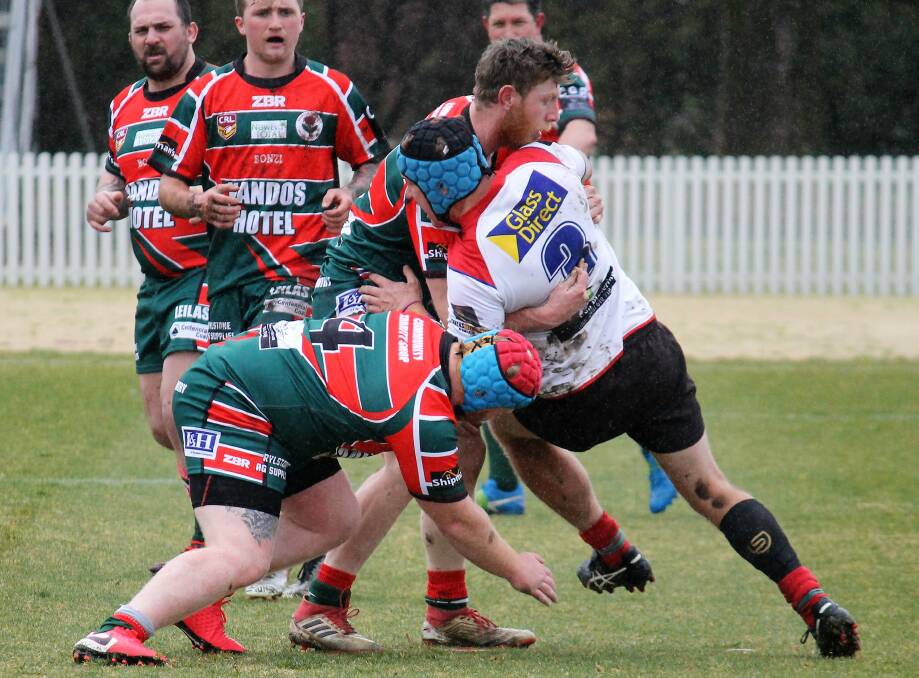 DEFENCE: Ethan Parsons and Daniel Steel making the tackle, Parsons' two late tries and the boot of Steel kept Kandos in the match in the closing stages. Photo: Supplied