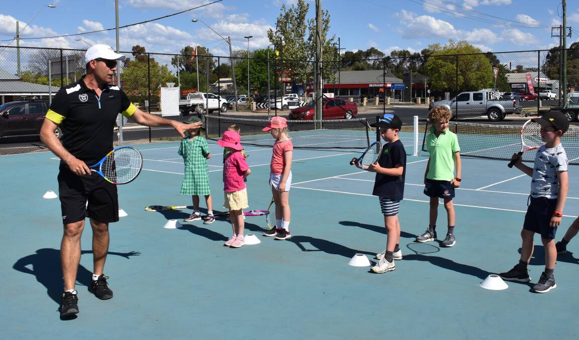 ACE: Mudgee District Tennis Club head coach Mario Cabral with a group of eager tennis players at Mudgee tennis courts. Photo: Jay-Anna Mobbs
