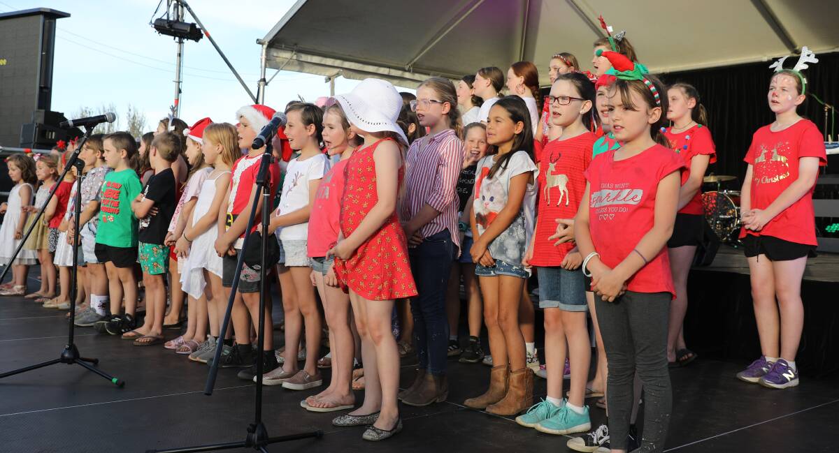 CHRISTMAS CHEER: Mudgee youngsters on stage performing during the 2019 Mudgee Showground Carols. Picture: SIMONE KURTZ