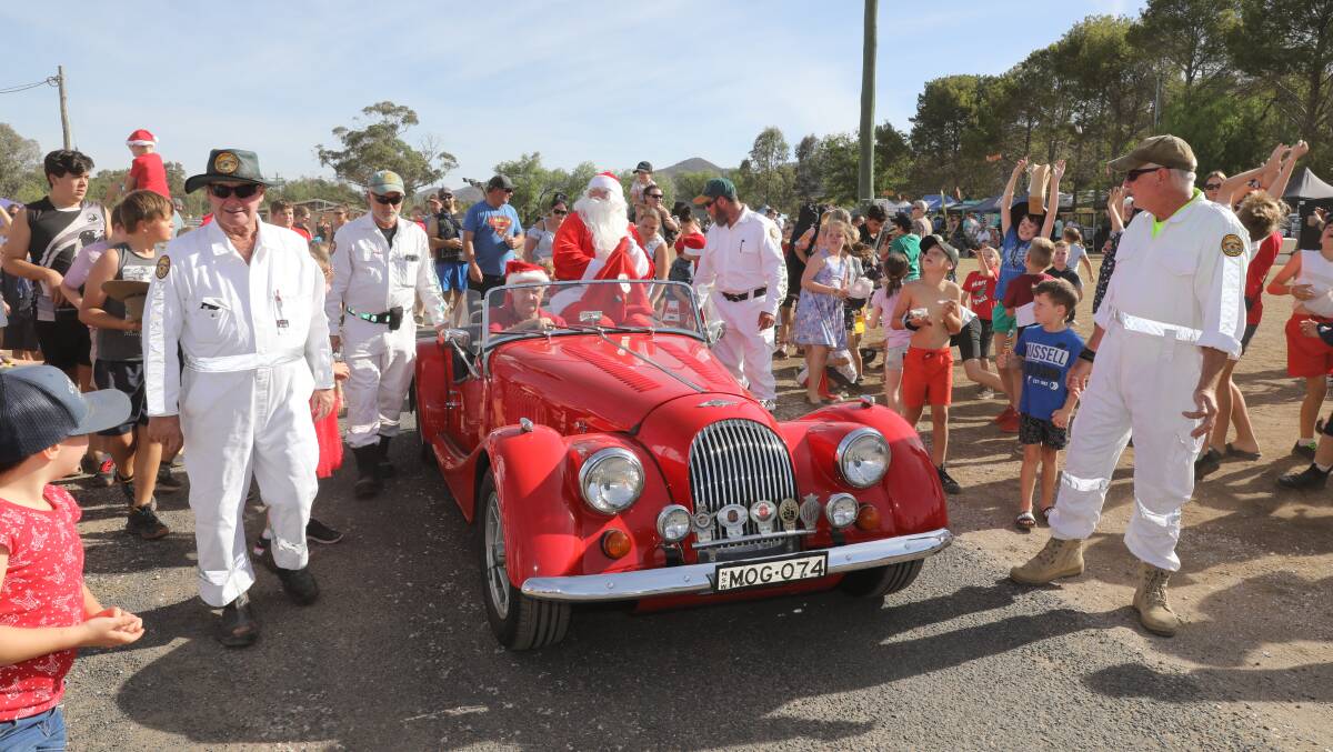 JOY: Santa saying hello to locals during the earlier hours of the 2019 Mudgee Showground Carols. Picture: SIMONE KURTZ