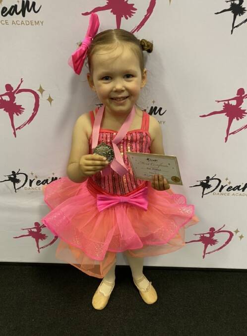 PROUD AS PUNCH: Ava Mitchell with her medal and certificate after a dance performance. Picture: SUPPLIED