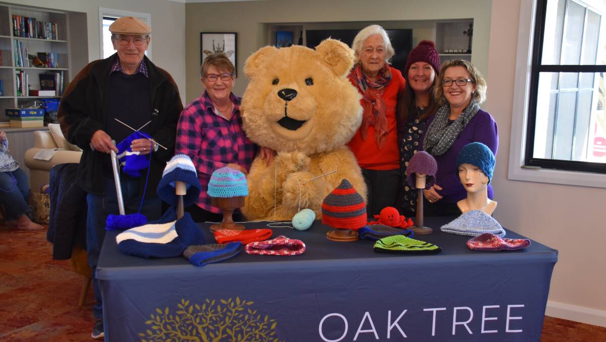 KNIT FOR CANCER: Rob Waller, Marie Dempsey, Dougal, Pam Francis, Linda Fielding, Rebecca Redfern. Photo: Jay-Anna Mobbs