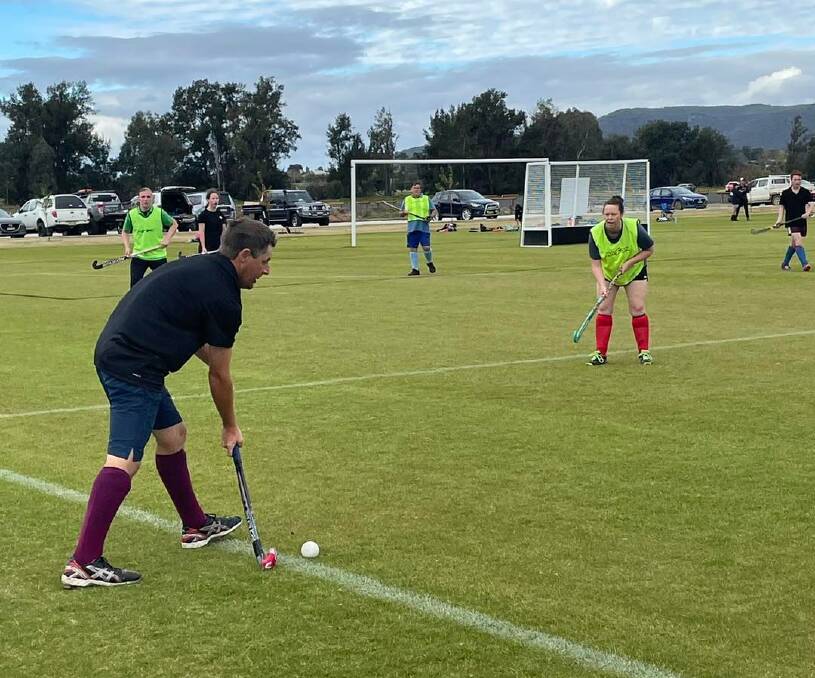 A Mudgee Hockey player brings the ball back into play from the sideline in round three of the seniors competition. Picture: Supplied