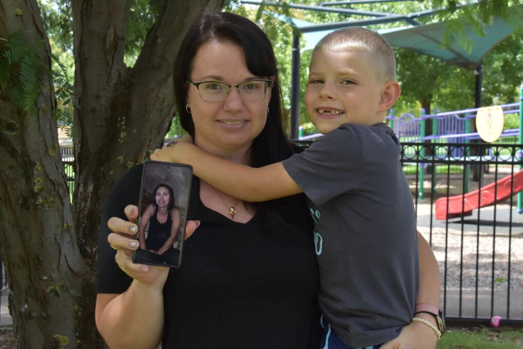 SHARED SUPPORT: Mudgee's Sara Beckinsale with her son Bradley James holding a photo of the Ukranian Airbnb host she booked a two-night stay with. Picture: JAY-ANNA MOBBS