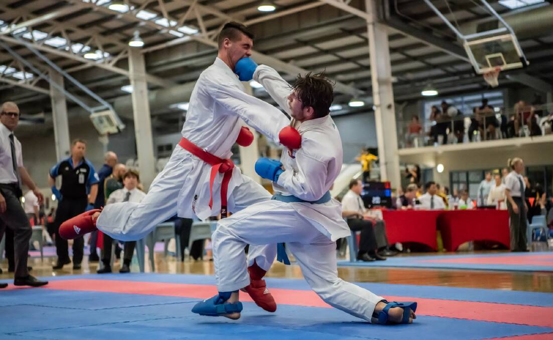 FIGHTER: Jordan Maher (blue) competing in Nationals. Photo: Supplied