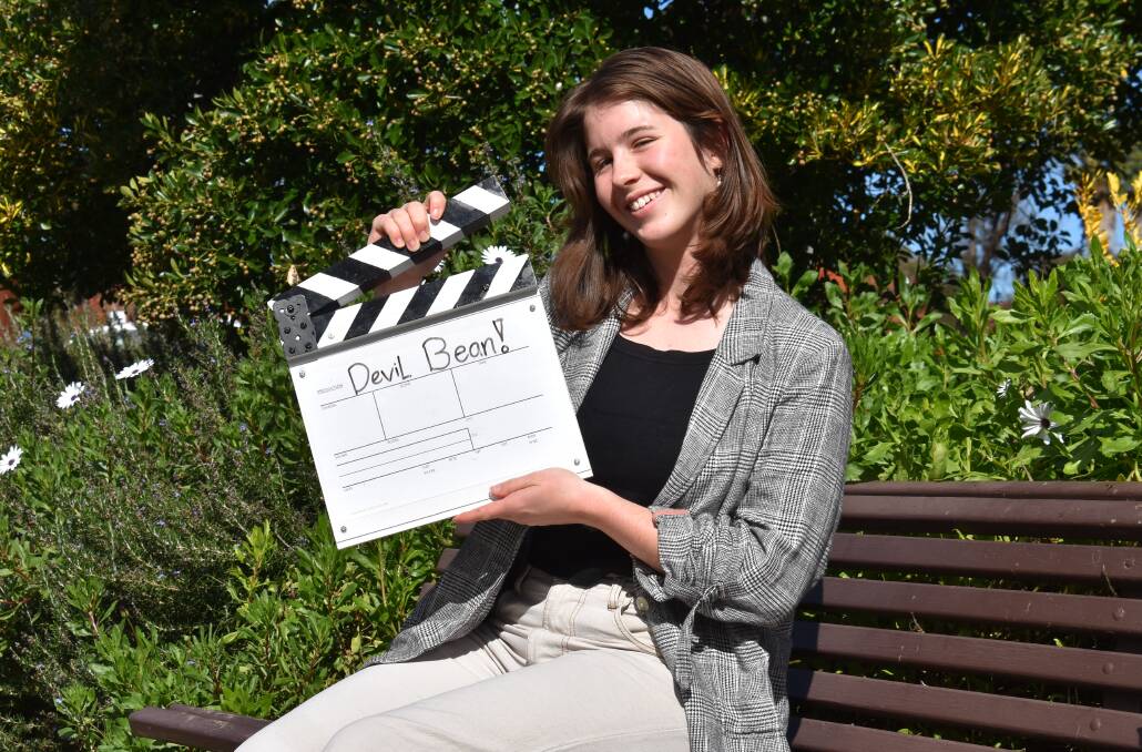 Jessica Nipperess in Lawson Park, Mudgee on May 17 this year holding a film slate that reads 'Devil Bean!'. Picture: Jay-Anna Mobbs