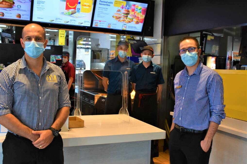 FOOD: McDonald's Mudgee licensee, Daniel Zammit with staff and McDonald's Mudgee assistant manager, Matthew Winter. Picture: JAY-ANNA MOBBS