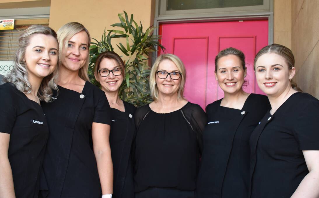 STATE LEVEL: Marg Ottley (middle) and her Ultimate Care team are in the running for Employer of Choice at the NSW Business Chamber Awards. Photo: Jay-Anna Mobbs
