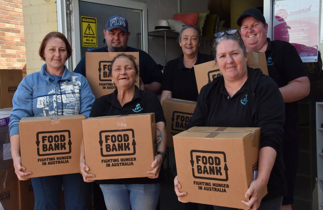 FOOD FARMERS: We Care Community Shop, Kylie Collins, Kerry Gregory
Tracey Crit Cher, Becki Wheeler, Rick Weaver, Donna Collins, have received 60 hampers from Foodbank NSW and Act for local farmers. Photo: Jay-Anna Mobbs