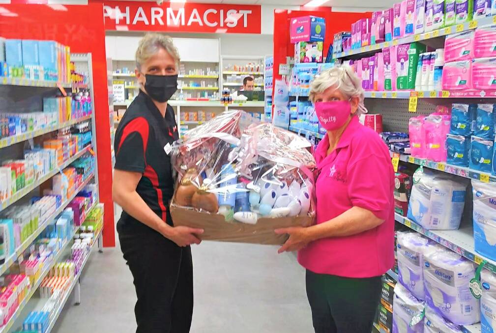 PERIOD: Leiza from Pharmacy 4 Less with Mudgee Share the Dignity volunteer, Joy Shawe with a #ItsInTheBag donation. Picture: SUPPLIED