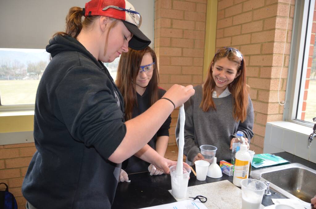 SLIME TIME: Portland Central students Maddye Neaves, Jasmine Tregear and Mikaila Milne make thermochromic slime. Picture: PHOEBE MOLONEY. 