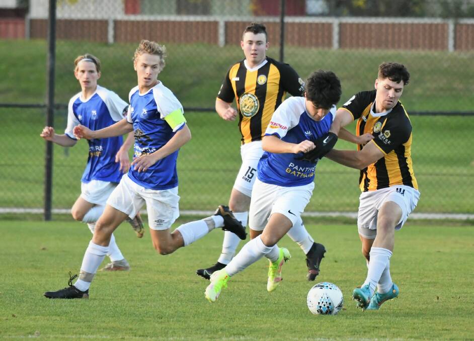 SHARED SPOILS: Bathurst '75 came from two goals down to draw with the Mudgee Wolves. Photos: CHRIS SEABROOK