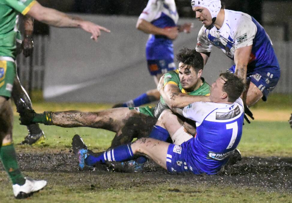 WAIT CONTINUES: St Pat's halfback Blake Fitzpatrick drags an Orange CYMS rival to the deck on Saturday night. CYMS won the game to extend it's winning streak over the Saints. Photo: JUDE KEOGH