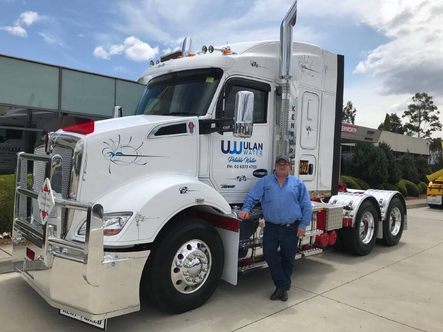 LOCAL TEAM: Ulan Water operations manager Mathew Buchanan with one of his Kenworth T610 trucks from the company fleet. Photo: Supplied
