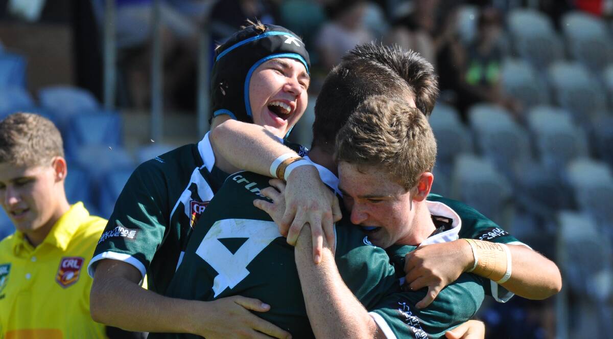 ENJOYING IT: Rams centre Mason Pollack is swamped by teammates Tyler Colley, Cooper Monk and Rylee Blackhall (obscured) during Western's semi-final victory. Photo: NICK McGRATH