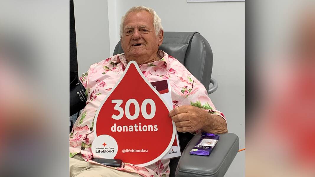 James Webb from Dunedoo sits in the blood donor chair with a certificate that reads '300 donations'. Picture supplied