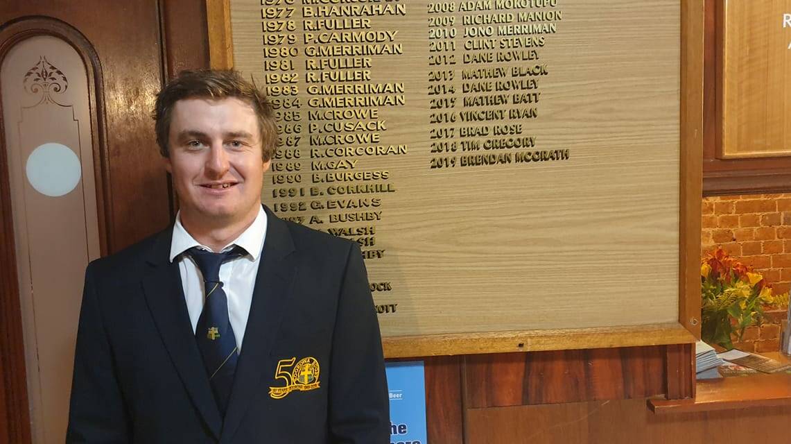 NO HALF MEASURES: Boorowa halfback Brendan McGrath poses in front of the Goldies' best and fairest honour board, after claiming the gong. Photo: BOOROWA RUGBY CLUB