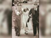 Detectives escort Lee to the city watch house on November 8, 1949. Picture: File