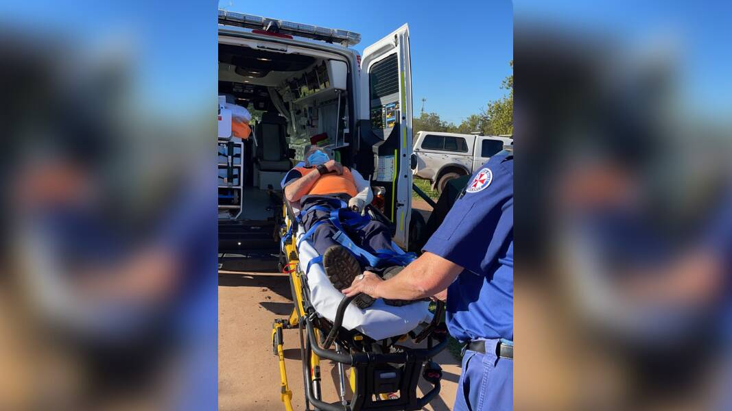 Whitton resident Allan Dart prepares to be transported via ambulance to Griffith Base Hospital following the brown snake bite on Father's Day before later being airlifted to St Vincent's Hospital in Sydney. Picture supplied by Allanna Dart