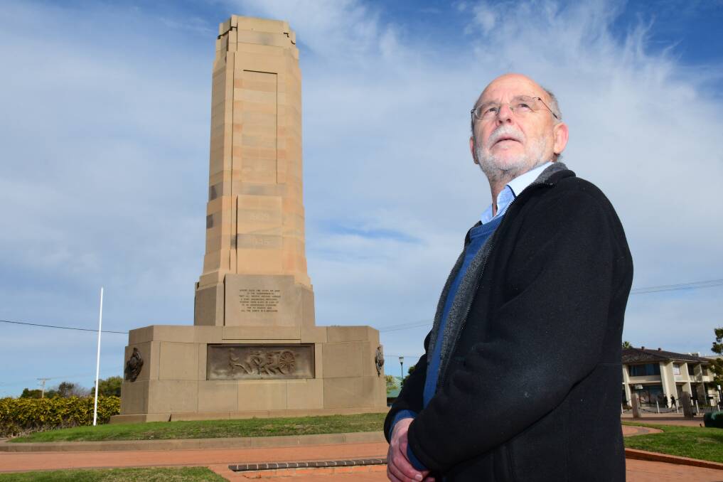 Delving deep: Historian Peter Woodley reflects at Dubbo's cenotaph. He reports Wongarbon claimed it had the first war memorial on "the western line", but Dubbo's came into focus from its unveiling in 1925. Photo: BELINDA SOOLE