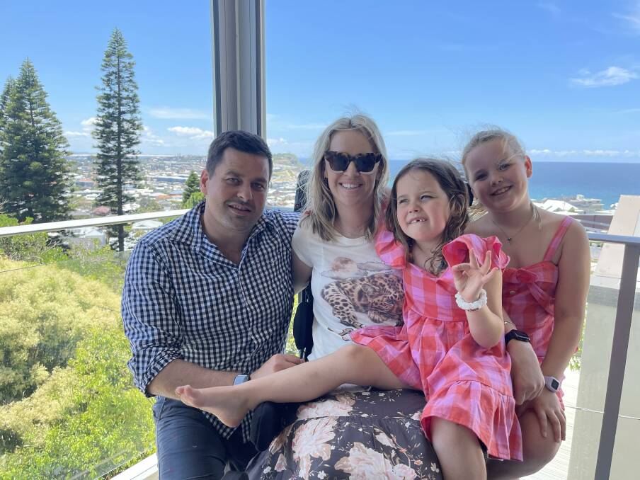 Together: Katherine Swain, centre, suffered a C5/C6 spinal injury in August. She is pictured here with husband David, and daughters Abbie, 5, and Chloe, 8.