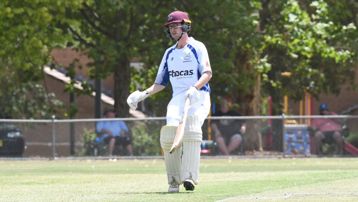 COME IN, SPINNER: Mitch Black with bat in hand for Orange on Sunday at Riawena Oval. He took five wickets with ball in hand, and also made 25. Photo: CARLA FREEDMAN.