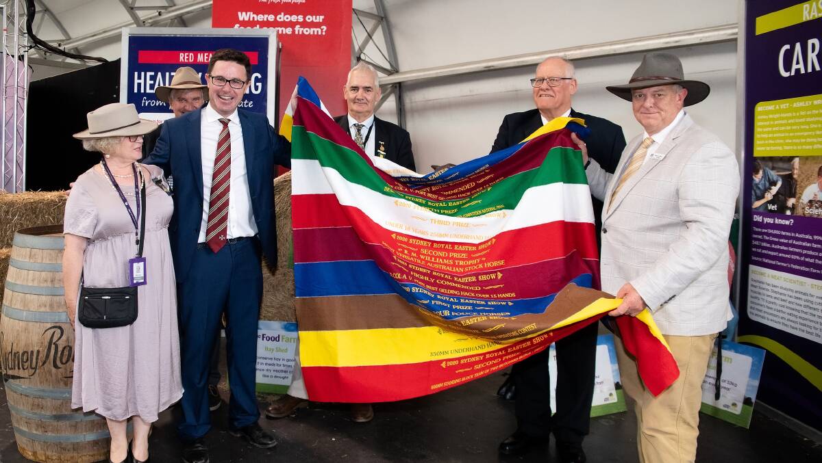 Ribbons-to-rugs: Minister David Littleproud (third from left) with Murray Wilton (far right) and RAS Councillors (L-R), Sally Evans, Robert Kell, Chris Carter and Geoff Bell at the Show. PIcture: Supplied.