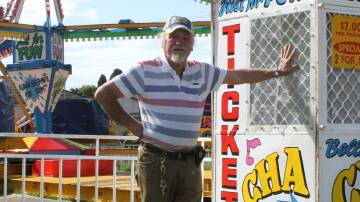Roy Arnold Bell stands beside his spinning Cha Cha ride at the Bega Showground ahead of the 2017 Bega Show. Picture by Alasdair McDonald