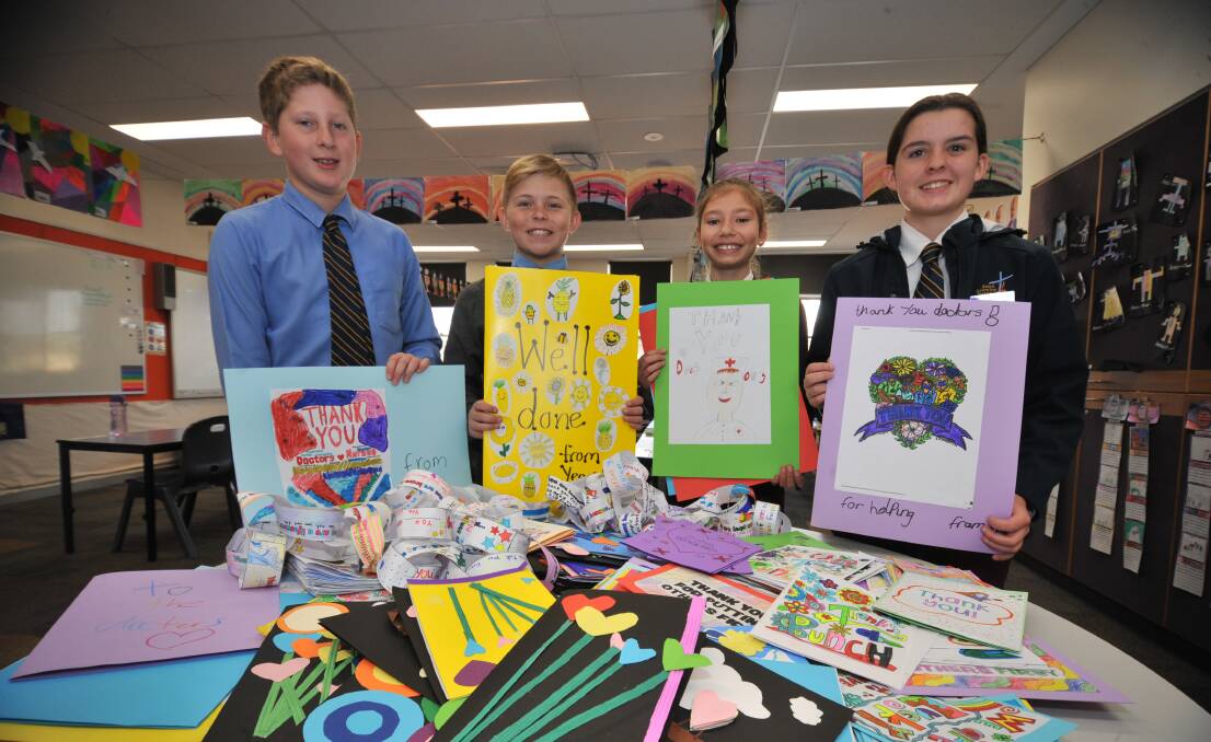 THOUGHTFUL: William Vial, Kody Wasow, Paityn Klaare-Smith and Isabelle Waters showing off the letters that will be sent to Liverpool hospital.