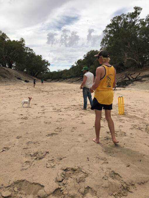 Short dog leg - the cricket match is underway on the Darling River's dry bed and everyone was on hand to join in the gala event to help boost morale of farmers hit hard by dry times. Pictures courtesy of Belinda Bennett.