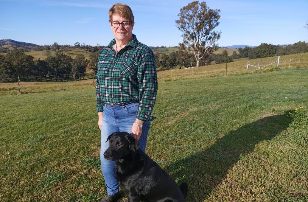 Outgoing CWA president Stephanie Stanhope at Bega with her friend's dog Zeb. She rebuilt her family home after it was lost in the fires. Photo by Ben Smyth.