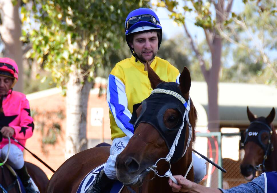POSITIVE SIGNS: Michael Hackett, pictured prior to a past race at Dubbo, spoke to those around him briefly on the weekend. Photo: BELINDA SOOLE
