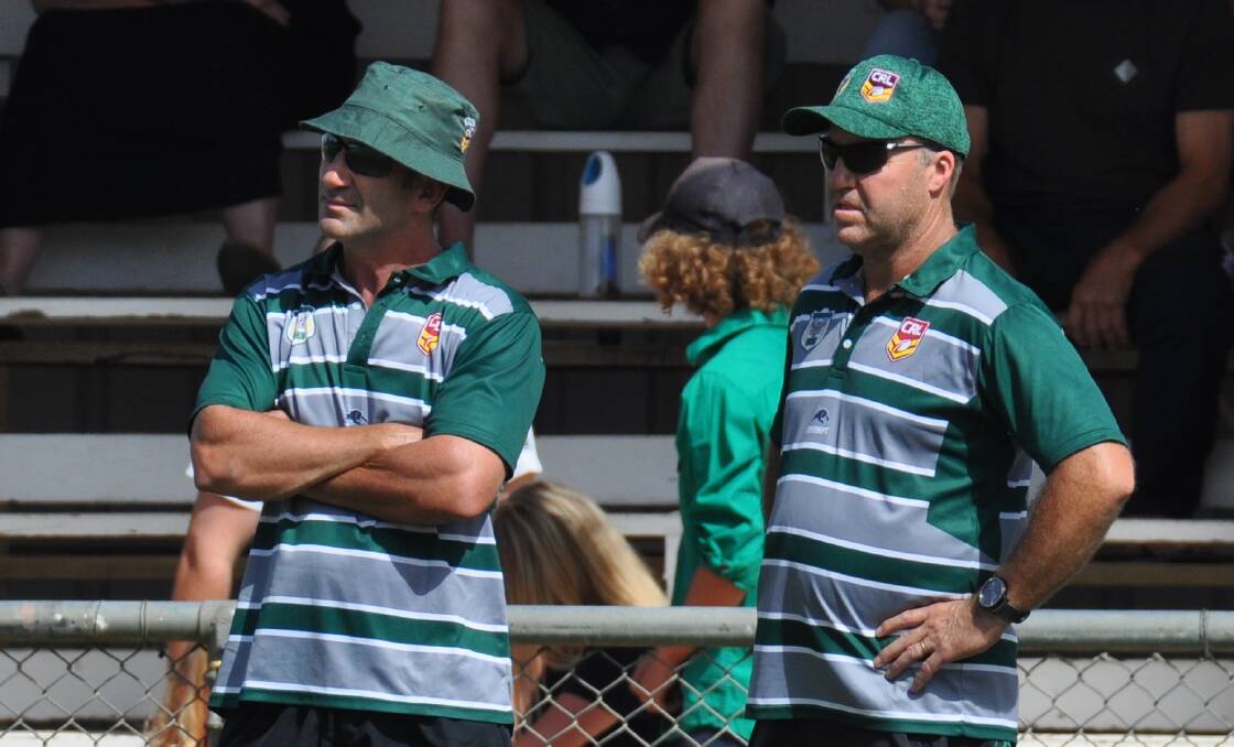 BACK AGAIN: Tony Woolnough (left) watches on during one of the Western Rams' matches last season. Photo: NICK McGRATH