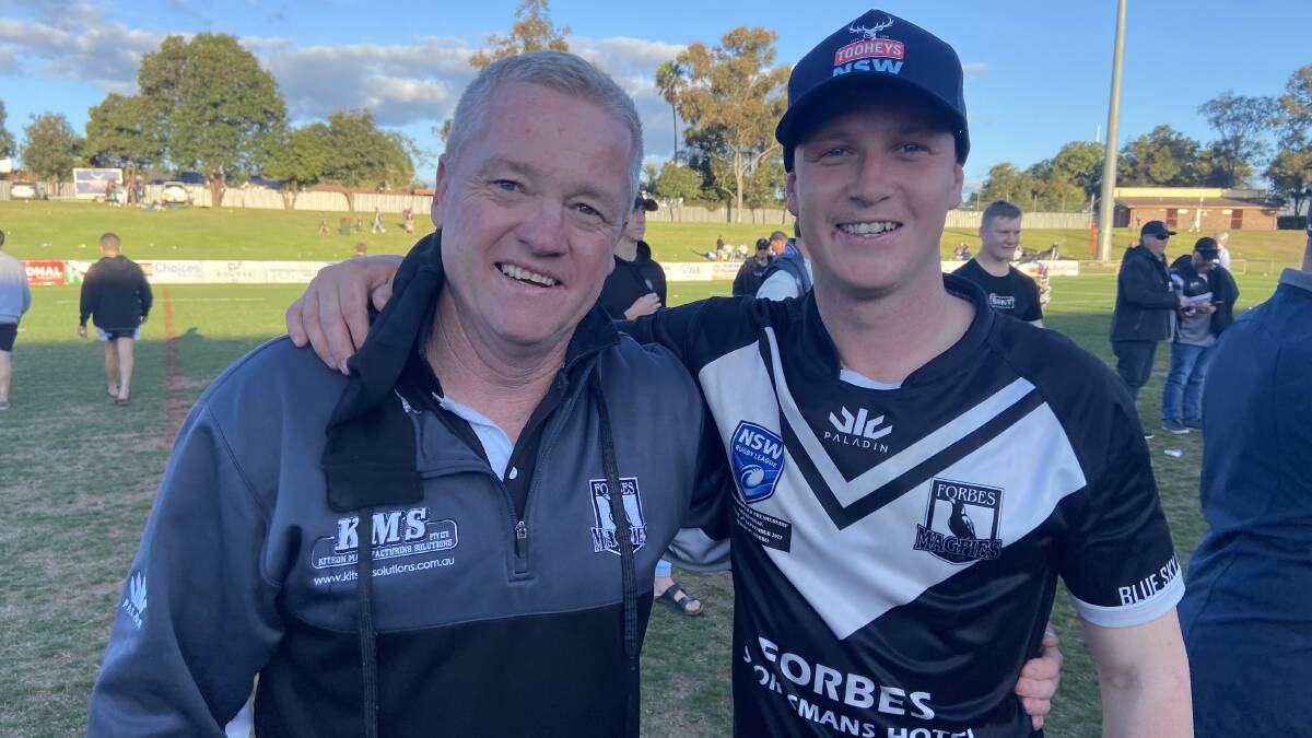 Cameron Greenhalgh, pictured with son Nick after Forbes' 2022 grand final win, will be back coaching the Magpies next season. Picture by Nick Guthrie