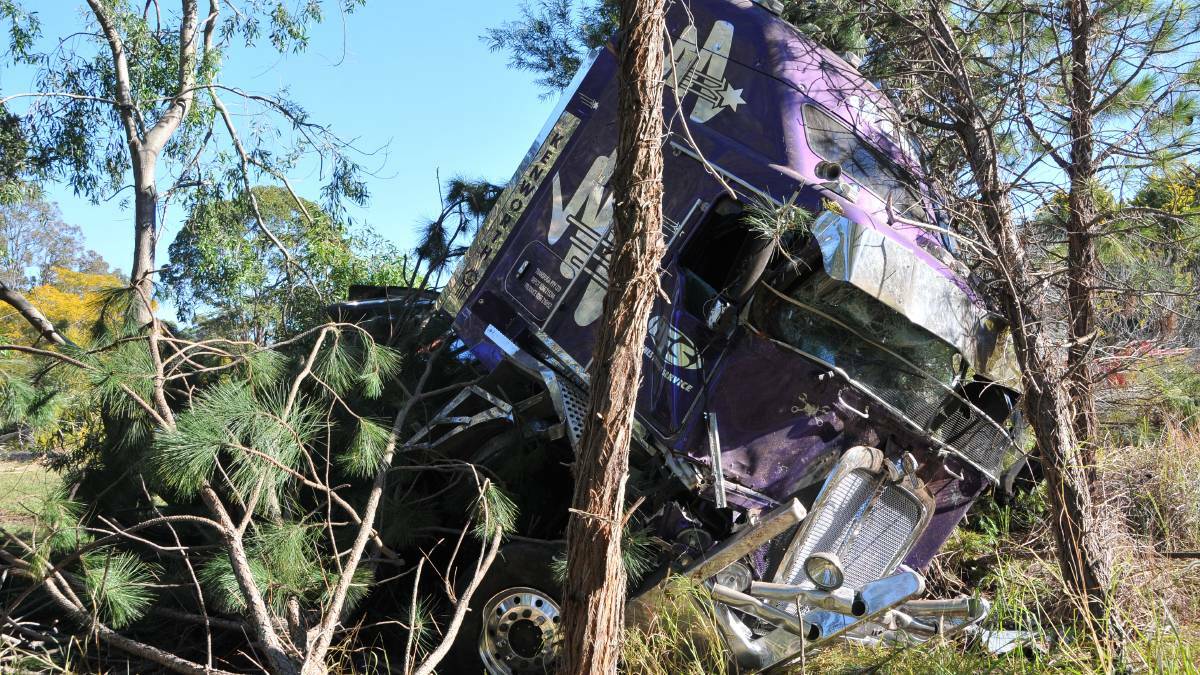 The truck was heading north when it crossed over the south-bound lane and flew into bush on the side of the Pacific Highway. CLICK THE PHOTO FOR THE FULL STORY